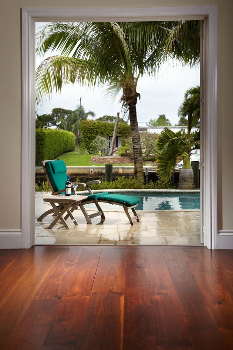 walnut wide plank flooring view outside to pool