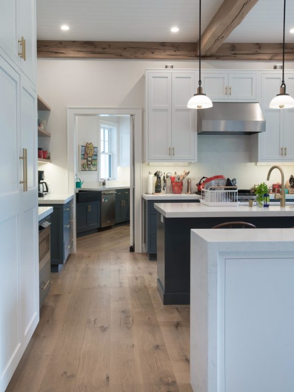 white oak flooring in kitchen with blue painted islands