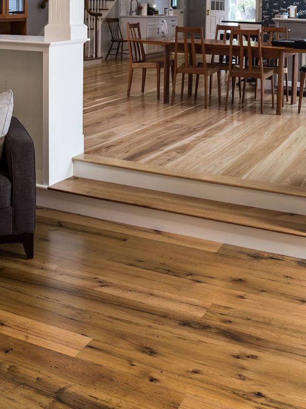 reclaimed wide plank flooring step up to dining room
