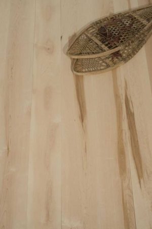 maple floor with cross country snow shoes