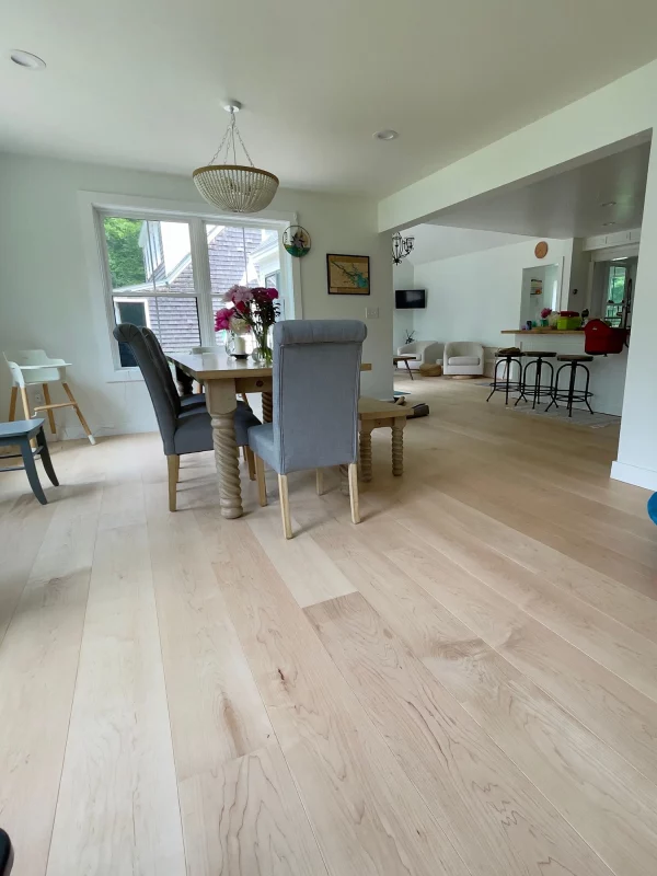 maple flooring in open concept dining room