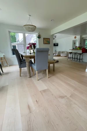 maple flooring with dining room table