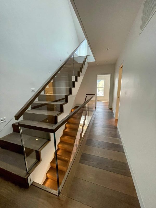 White Oak flooring in a hallway leading to a staircase