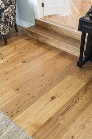 recalimed heart pine in living room with two steps into hallway