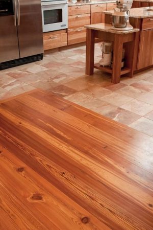 recalmied heart pine abutting tile kitchen floor