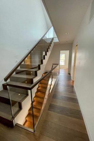 white oak flooring in hallway with stairs