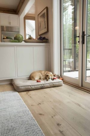 white oak flooring with dog asleep in bed